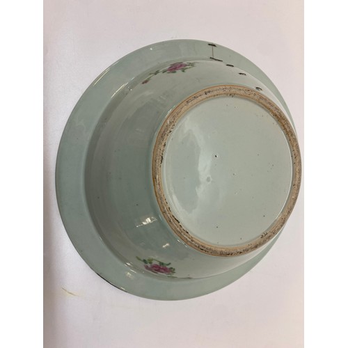 128 - A 19th Century Cantonese toilet bowl decorated in alternate reserves with figures in interiors, vase... 