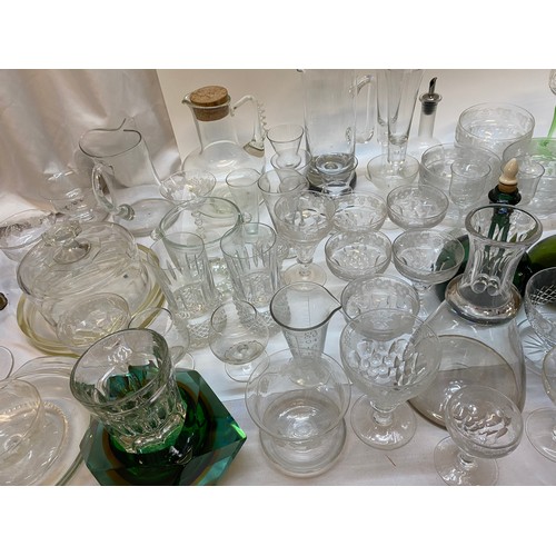 141 - A selection of glassware including sundae dishes, wines, hocks, green bottle etc..