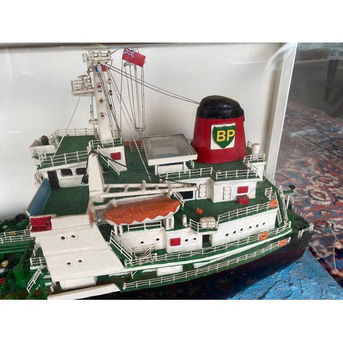 283 - A large painted wood model of the BP oil tanker British Esk of London, in display case - 72in. long