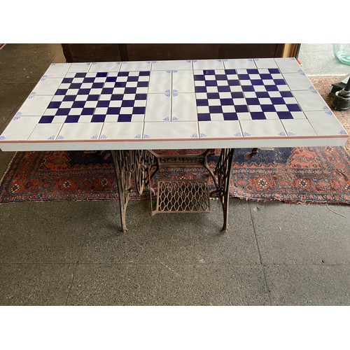 52 - Two Singer treadle sewing machine bases converted to tables, one with blue and white tiled top