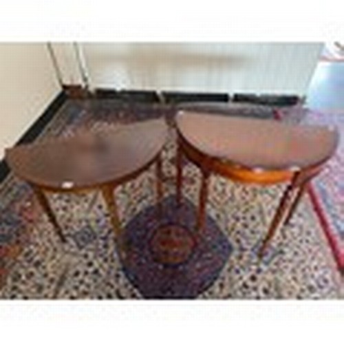 58 - A nest of three reproduction yewwood occasional tables with inlaid paterae to the top, on slender ca... 