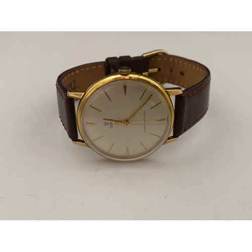 262 - A gentleman's Tudor wristwatch in a gold plated and stainless steel case, on brown leather strap