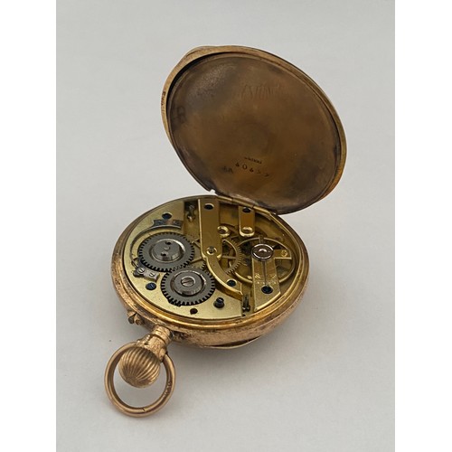 277 - A lady's openface pocket watch with engraved gold dial, in an 18kt. gold case