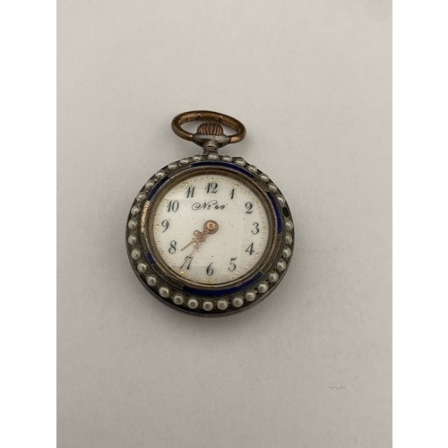 290 - A lady's openface fob watch with white enamel dial, blue numerals, in a white metal case decorated i... 