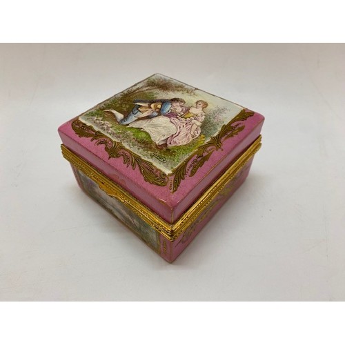 207 - A Sevres square trinket box, pink ground decorated two lovers to the lid within gilt leaf border, th... 