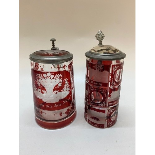 230 - Two Bohemian ruby flashed tankards with pewter mounts