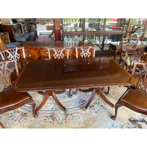 40 - A Georgian design mahogany and satinwood crossbanded dining table with rectangular top, extra centre... 