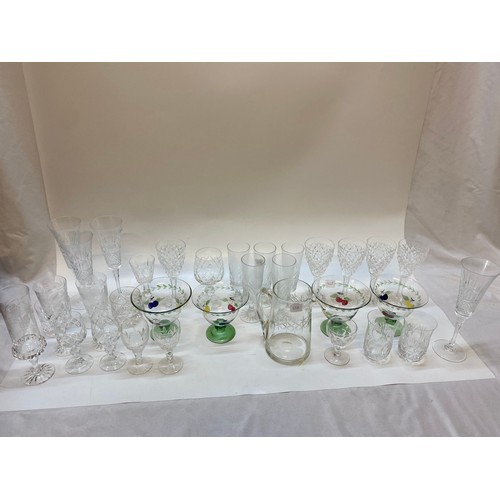 228 - A selection of table glass including wines, tumblers, sherries, slice cut fruit bowls, ice plates, f... 