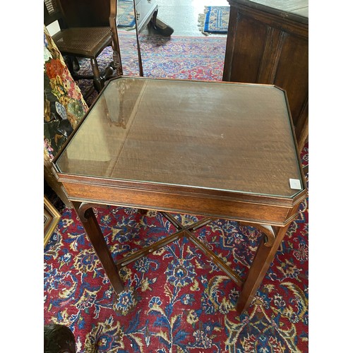 128 - An oak occasional table with rectangular top, carved frieze, on barley twist legs united by straight... 