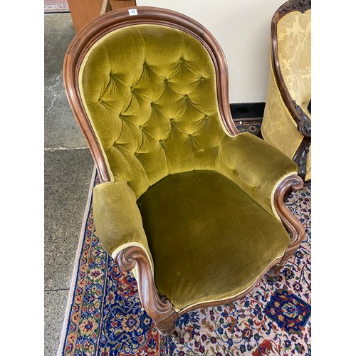 41 - A Victorian mahogany framed armchair with curved back, on turned legs terminating in castors