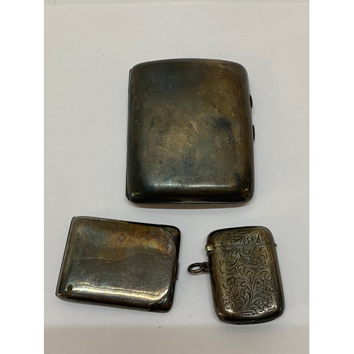142 - A silver cigarette case, a silver vesta case and a silver match book case