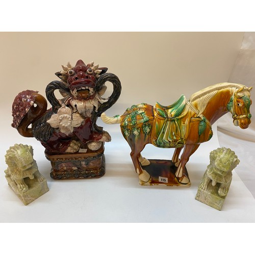 115 - A large pottery model of a Tang style horse - 18in. high, a pair of Chinese soapstone models of Dogs... 
