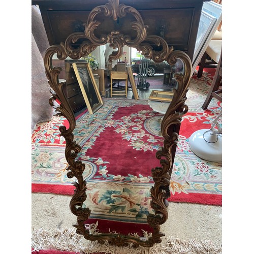 79 - A wall mirror in a gilt frame - 36in. x 12in.
