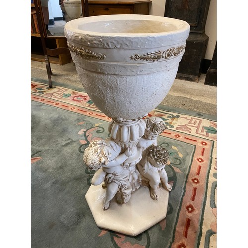 83 - A cream decorated jardiniere stand on shaped base - 25in. high