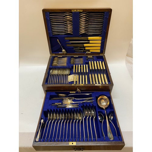 133 - An oak canteen box with hinged lid and drawer containing Walker and Hall flatware