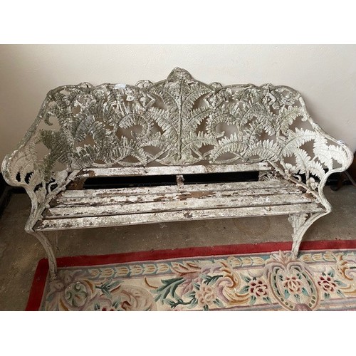 43 - A white painted aluminium garden bench with fern leaf decoration, wooden slats