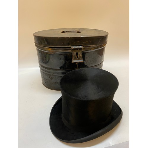 314 - A top hat in a black tin hat box