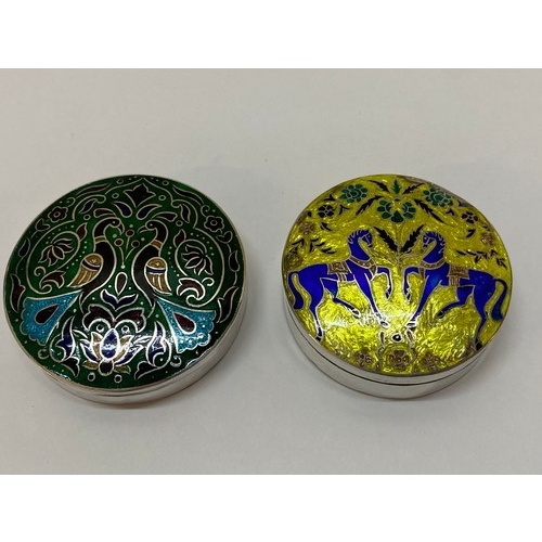 279 - Two circular silver trinket boxes, the lids with enamel decoration - 2 1/2in. dia. and 2 1/4in. dia.