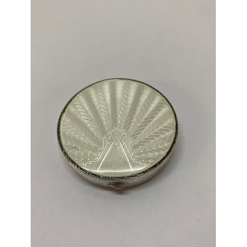 277 - A circular silver pill box with white guilloche enamel decorated lid - Birmingham 1933 - 2in. dia.