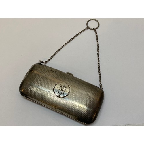 269 - A lady's silver purse with monogram to the cartouche and all over engine turned decoration - Birming... 