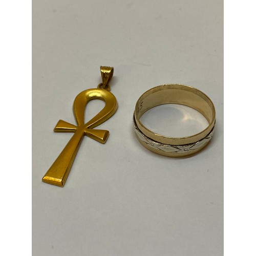 309 - A 9ct. gold wedding band and a gold coloured metal Ankh cross