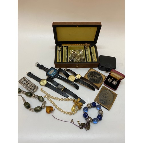 290 - A selection of costume jewellery including dress watches, cufflinks, earrings, glass heart shaped pe... 