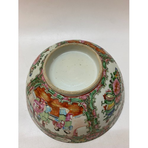 153 - A Cantonese bowl painted in reserves with figures, flowers and exotic birds - 9in. dia.