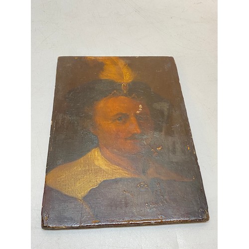 11 - A small oil on panel - Head and shoulders of a gentleman with a feather plumed hat - 7in. x 5in.