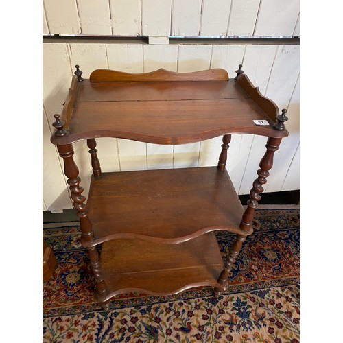 57 - A Victorian rosewood finished three tier whatnot with barley twist supports and shaped feet - 19in. ... 