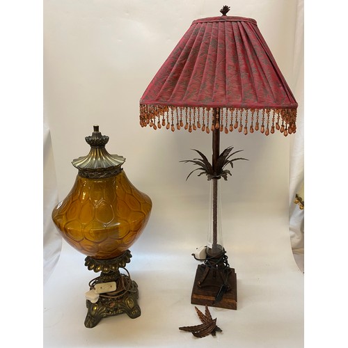 44 - A reproduction tablelamp in the form of an oil lamp with orange glass shade and one other glass and ... 