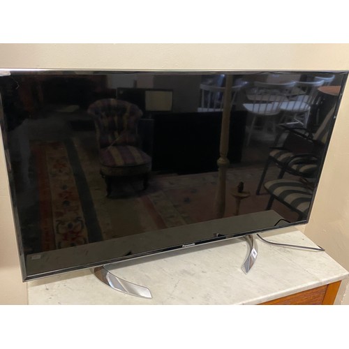 70 - A Panasonic television on stand