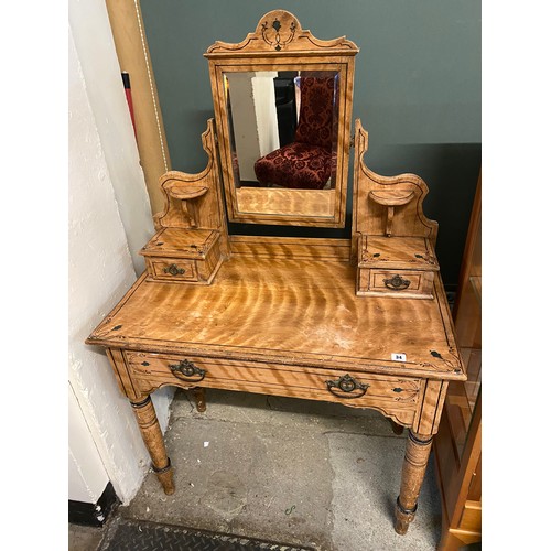 34 - A Victorian dressing table with painted decoration, fitted mirror, two jewel drawers, frieze drawer,... 