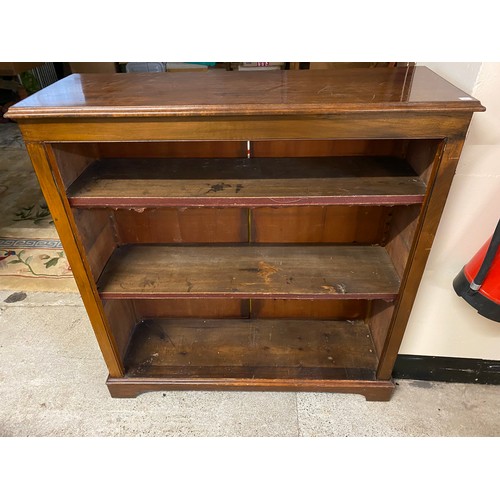 43 - An Edwardian walnut sidecabinet fitted frieze drawer above two carved panelled doors to urns of flow... 