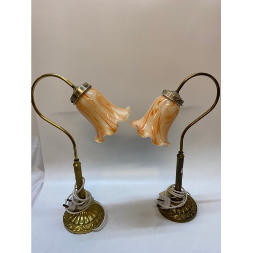 46 - A pair of brass tablelamp bases with peach glass flower form shades, reeded columns, on circular bas... 