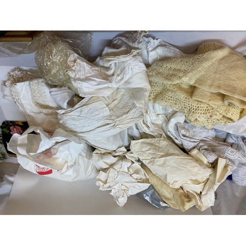 96 - A selection of linen and other including a Victorian christening gown, shawl, floral decorated fabri... 