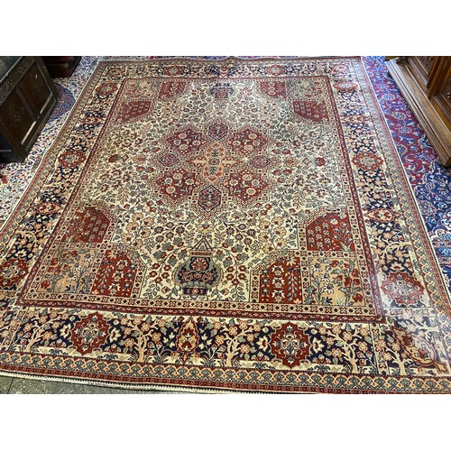 2 - A large Eastern pattern carpet, cream field with stylised floral decoration and multi border - 125in... 