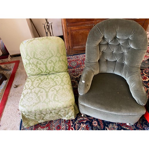 78 - A Victorian low seat armchair upholstered in buttoned green dralon, on short feet terminating in whi... 