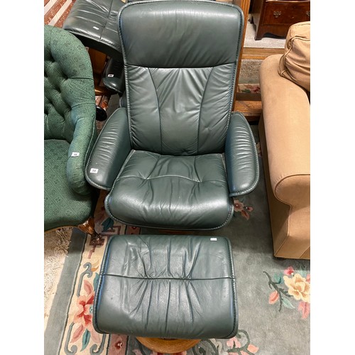 59 - A green leather Ekorness Stressless armchair and stool