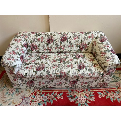 77 - A modern two seater settee upholstered in floral pattern material - 60in. wide