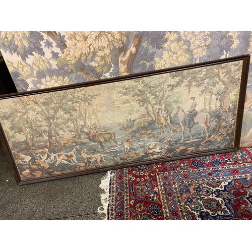 53 - A modern machine made wall hanging tapestry depicting a hunting scene with figures on horseback, a s... 