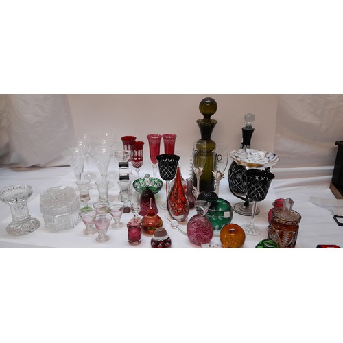 159 - A collection of coloured glass including set of six glasses, pair of red flashed champagne flutes, a... 