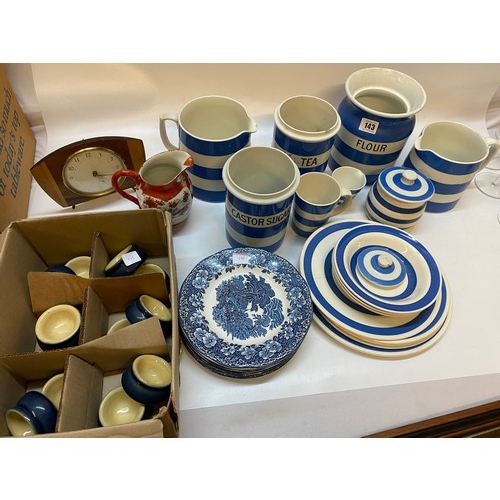 143 - A selection of TG Green and other blue and white striped kitchen china, a mantel clock, three pairs ... 