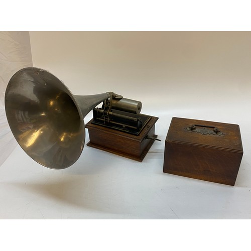 296 - A phonograph in an oak case, complete with horn