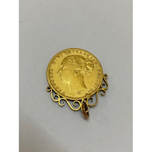 234 - A Victorian gold sovereign dated 1876 mounted as a pendant in a gold coloured metal mount