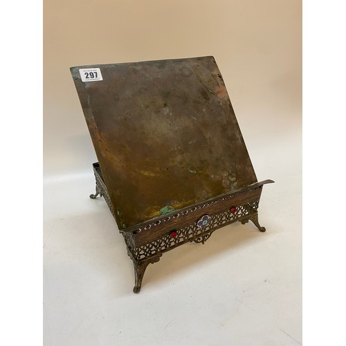 297 - An Eastern metal reading stand with adjustable slide, on a pierced base with red cabochon and floral... 