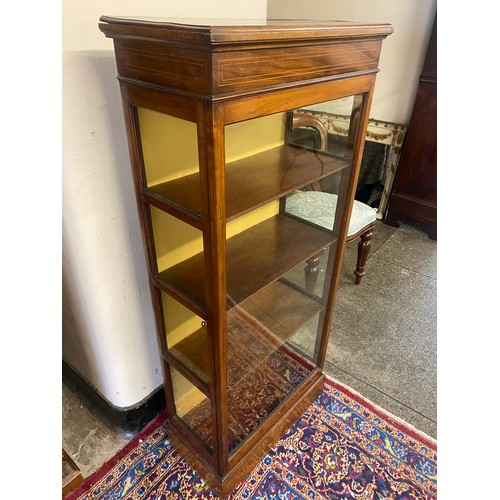 21 - A reproduction mahogany and satinwood line inlaid display cabinet fitted glass door to the side - 22... 