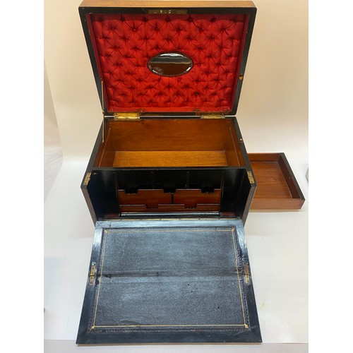 262 - A 19th Century mahogany and brass inlaid writing box with end carrying handles - 16in. wide