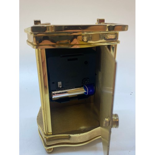 253 - An Imperial carriage clock, white enamel dial, in a brass and glass case - 5in. high