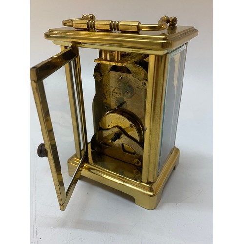 256 - A carriage clock by Bayard in a brass and glass case - 4 1/2in. high