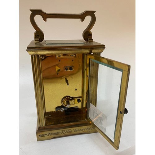 257 - A carriage clock retailed by Mappin and Webb in a bevelled glass and brass case - 4 1/in. high